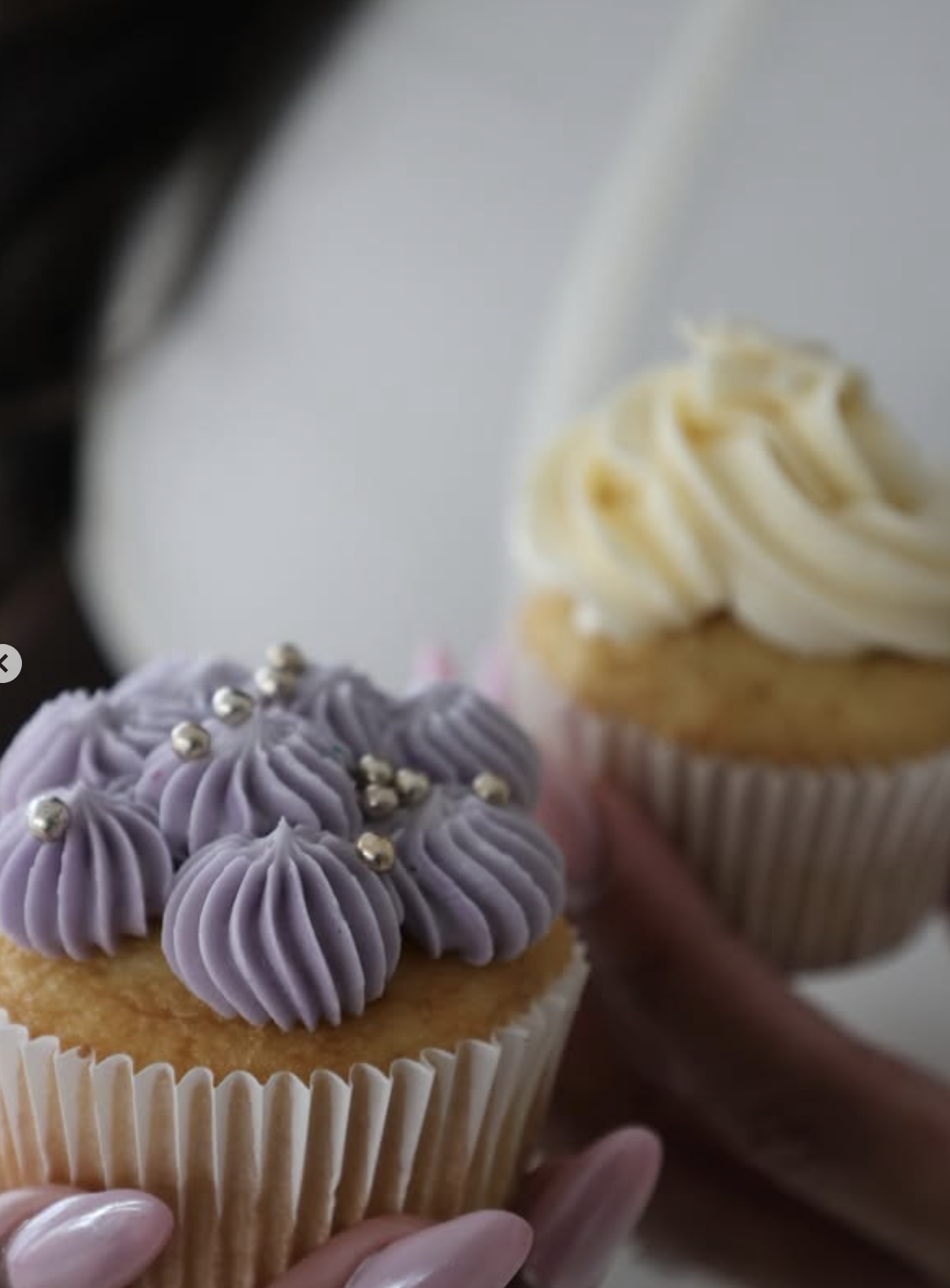Lavender buttercream cupcakes with silver pearl accents close-up